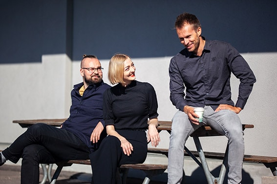 Jussi, Ida-Maria and Joonas enjoying their coffee break outside.